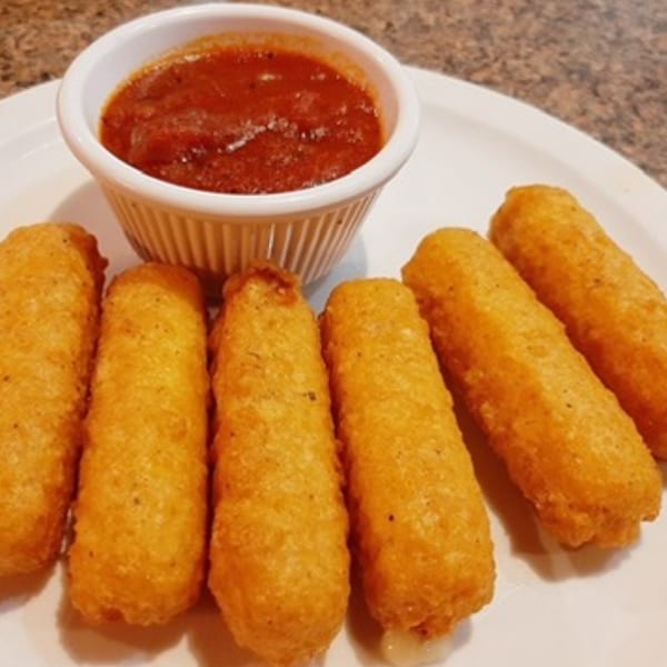Six golden-brown mozzarella sticks are arranged on a white plate with a side of marinara sauce.