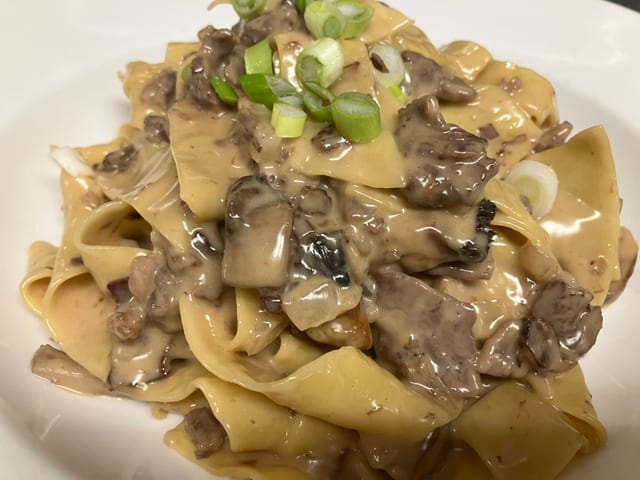 Beef Stroganoff Linguine & Side Garden Salad w/ House Dressing.